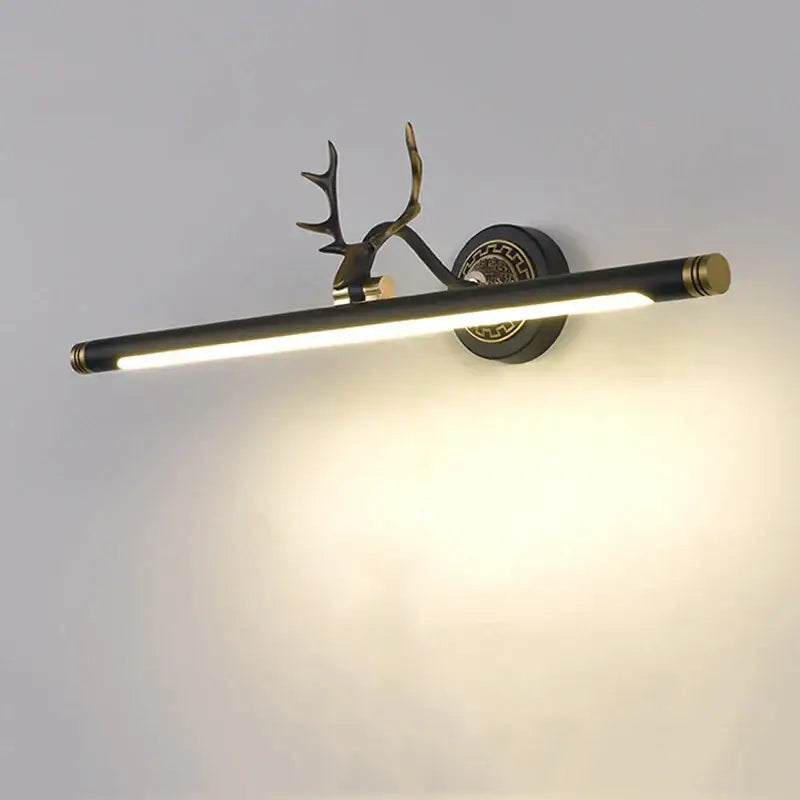 A sleek black and brass decorbites antler 8w led mirror light sconce for bedroom and bathroom wall mounting