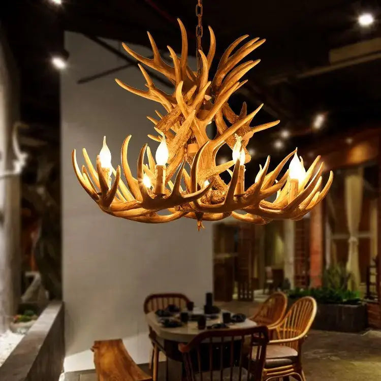 DecorBites antler chandelier with warm golden finish and resin horns featuring candle-style bulbs for rustic indoor decor