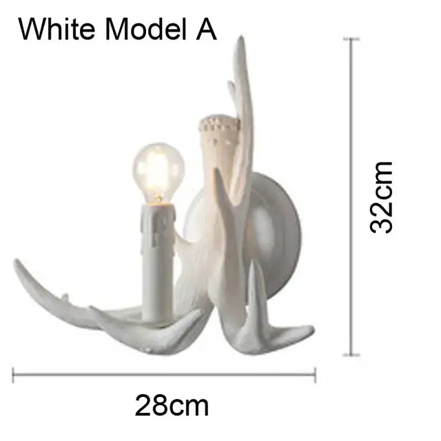 White ceramic wall sconce resembling a stylized candle with branching antler arms in decorbites antler chandelier design