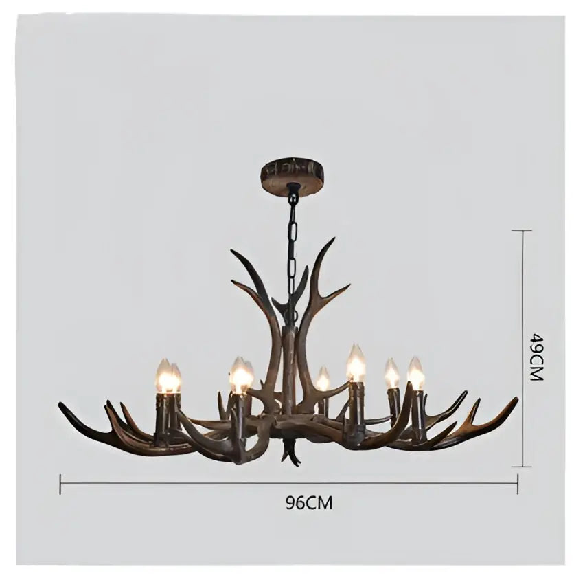 Decorbites antler chandelier with dark bronze resin finish and lit candle-style bulbs for modern rustic living rooms
