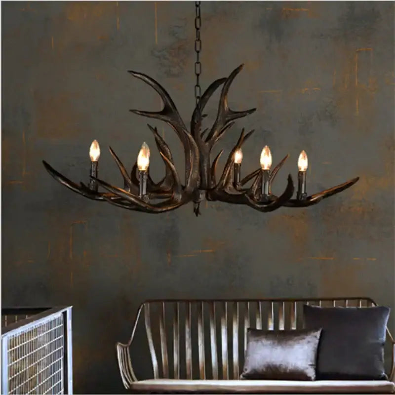 Dark bronze decorbites antler chandelier with five lit candle-style bulbs rustic resin lamp for restaurant cafe decor