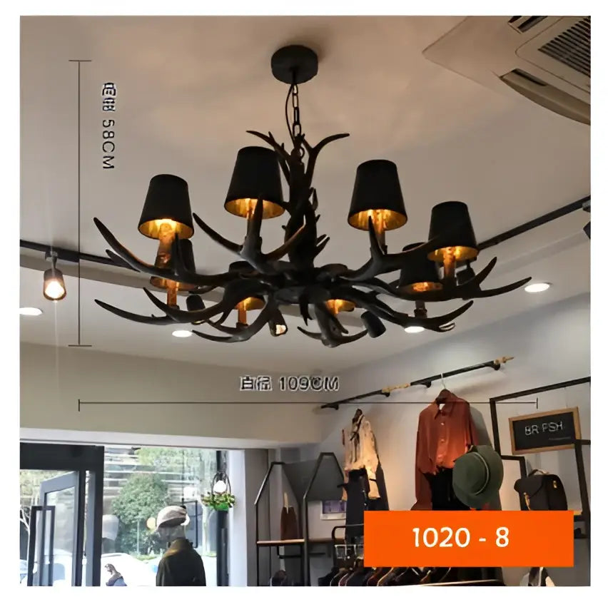 Black decorbites antler chandelier with six lampshades featuring gold interiors made of rustic resin for cafe decor
