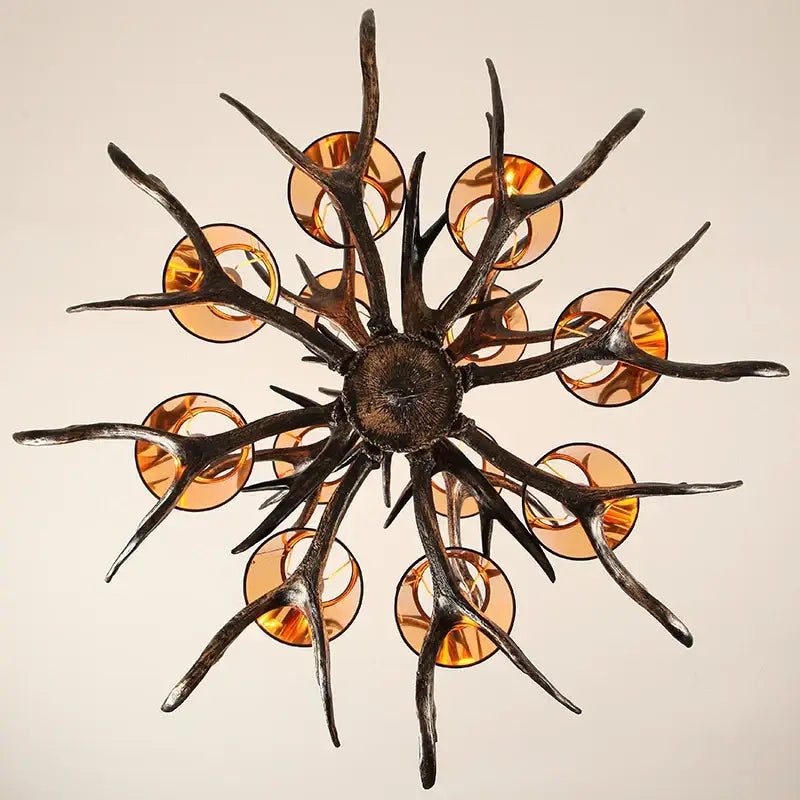 DecorBites antler chandelier with dark rustic metal arms and amber glass shades for vintage restaurant cafe decor