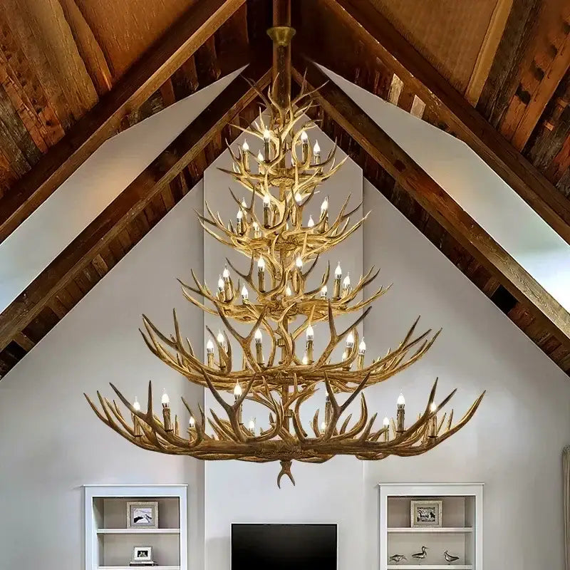 Golden decorbites antler deer chandelier with multiple resin tiers and candle-style bulbs for living room and loft lighting