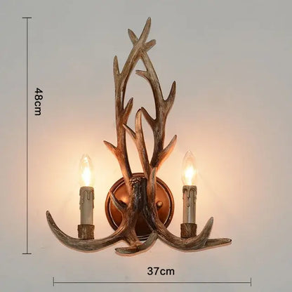 Decorbites antler pendant wall sconce with two candle-style bulbs in rustic bronze metal for industrial home decor lighting