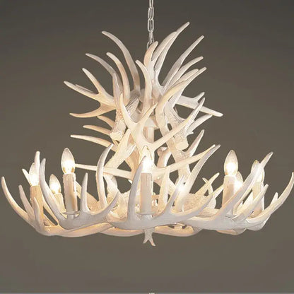 White antler pendant chandelier with six candle-style bulbs for living room decor by DecorBites Antler Pendant
