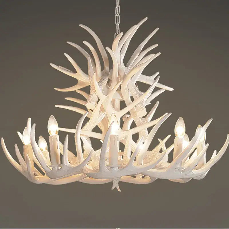 White antler pendant chandelier with six candle-style bulbs for living room decor by DecorBites Antler Pendant