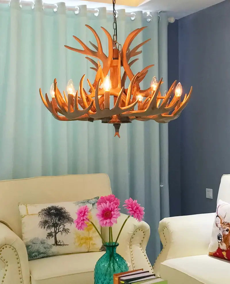 Decorbites antler pendant chandelier featuring warm-toned rustic wooden antlers with six glowing bulbs for living room decor