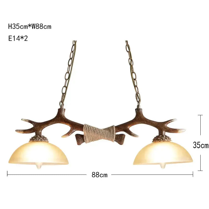 Decorbites antler resin chandelier featuring two warm glass shades and rustic brown finish suspended by metal chains