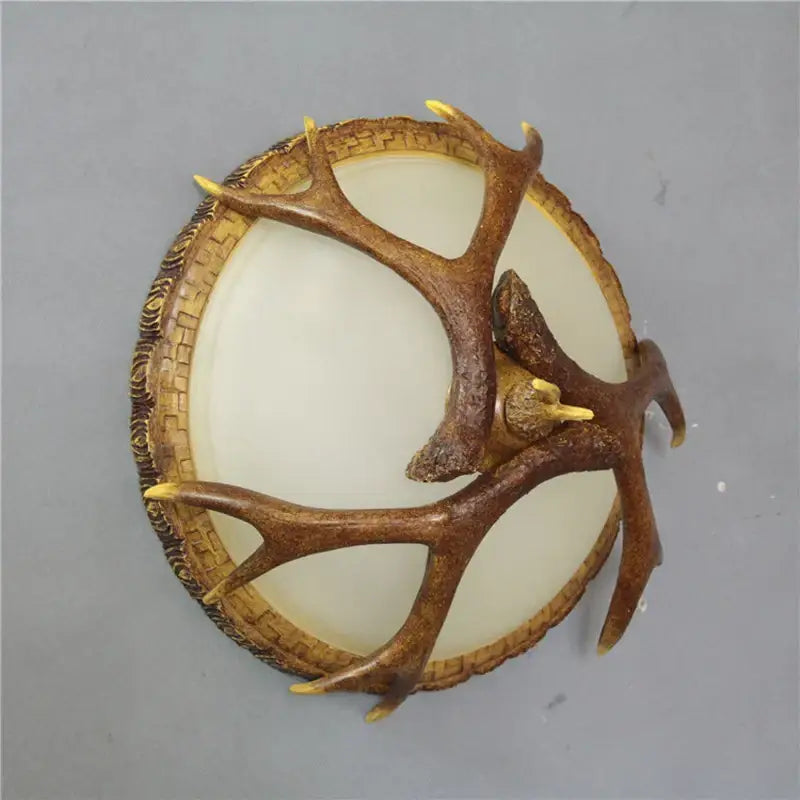 Brown faux antler wall decor with woven basket frame and cream center for DecorBites antler resin glass ceiling light