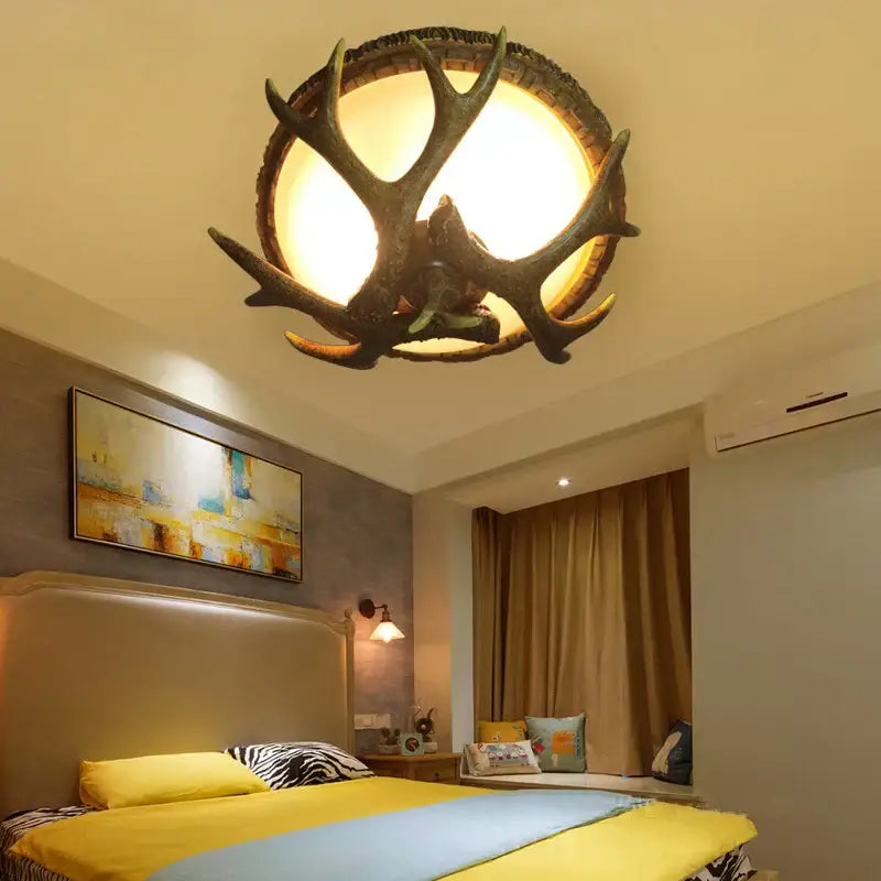 DecorBites antler resin glass ceiling light with rustic dark brown finish and warm glowing illumination for home decor