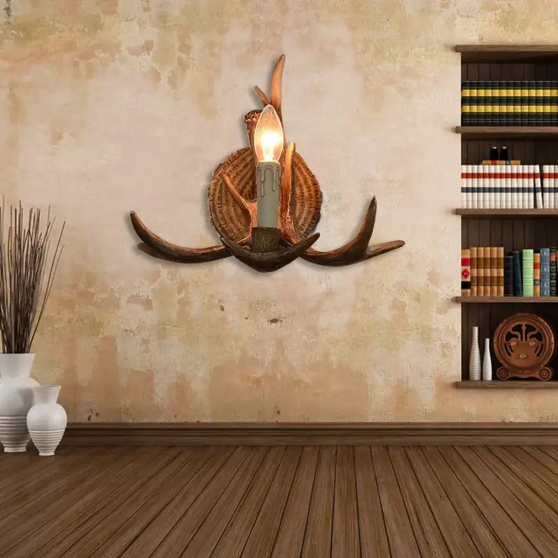 DecorBites antler resin wall lamp with dark brown antlers and warm bulb in woven basket base for living room decor