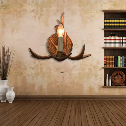 DecorBites antler resin wall lamp with dark brown antlers and warm bulb in woven basket base for living room decor
