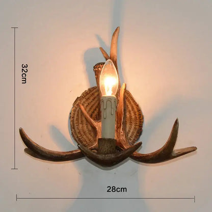Decorbites antler resin wall lamp with warm rustic finish and candle-style bulb for living room corridor or bar