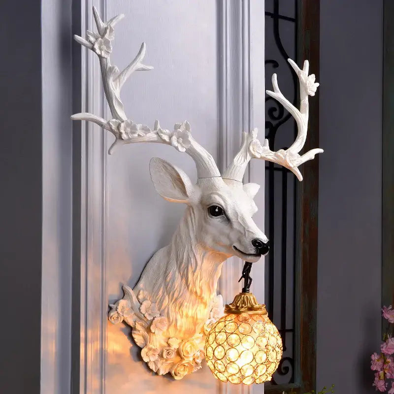 White deer head wall lamp by DecorBites antler wall with ornate resin antlers and golden globe lampshade decorbites antler wall