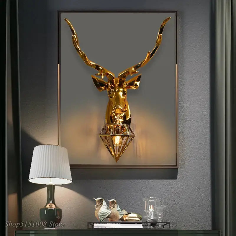Golden geometric stylized deer head wall light with diamond base and integrated bulb by DecorBites Antlers LED wall