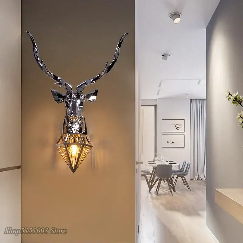 Decorbites antlers led wall light featuring a shiny chrome deer head with faceted gold-toned crystal shade for modern decor