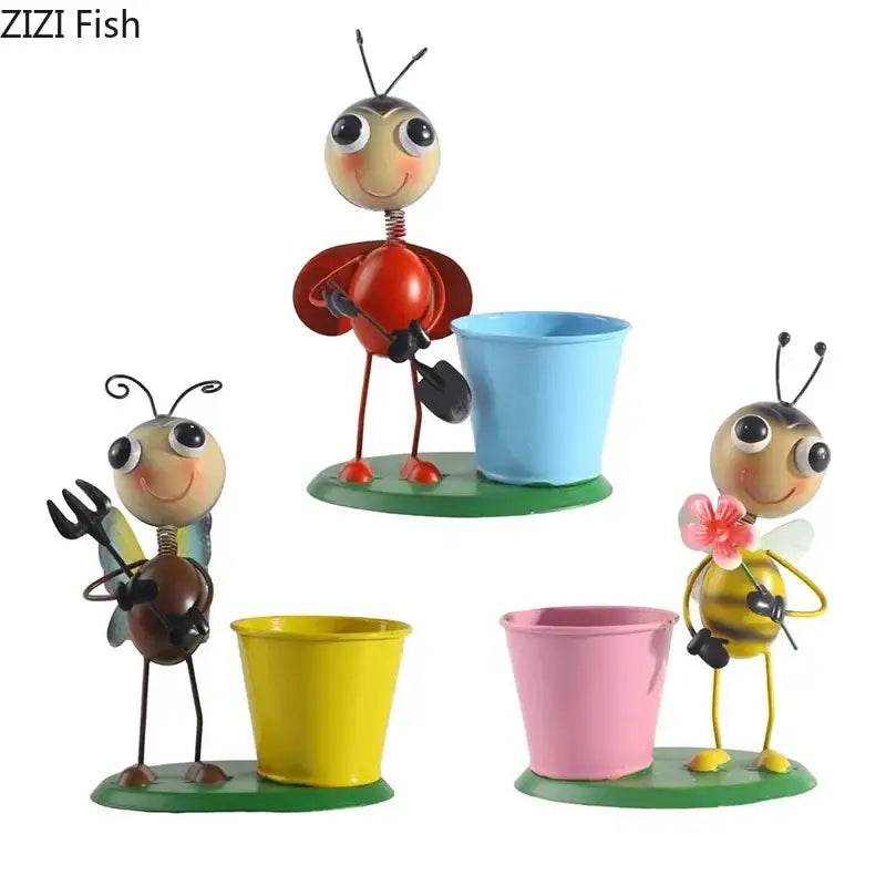 Cute metal ants gardener vase figurines with painted faces and colorful whimsical accessories for aesthetic decor
