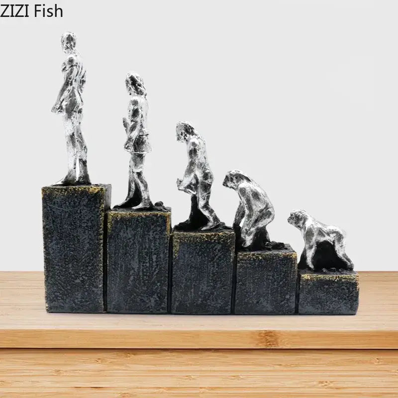 Silver-toned decorbites ape man evolution sculpture resin figurine set on five black textured pedestals representing human evolution