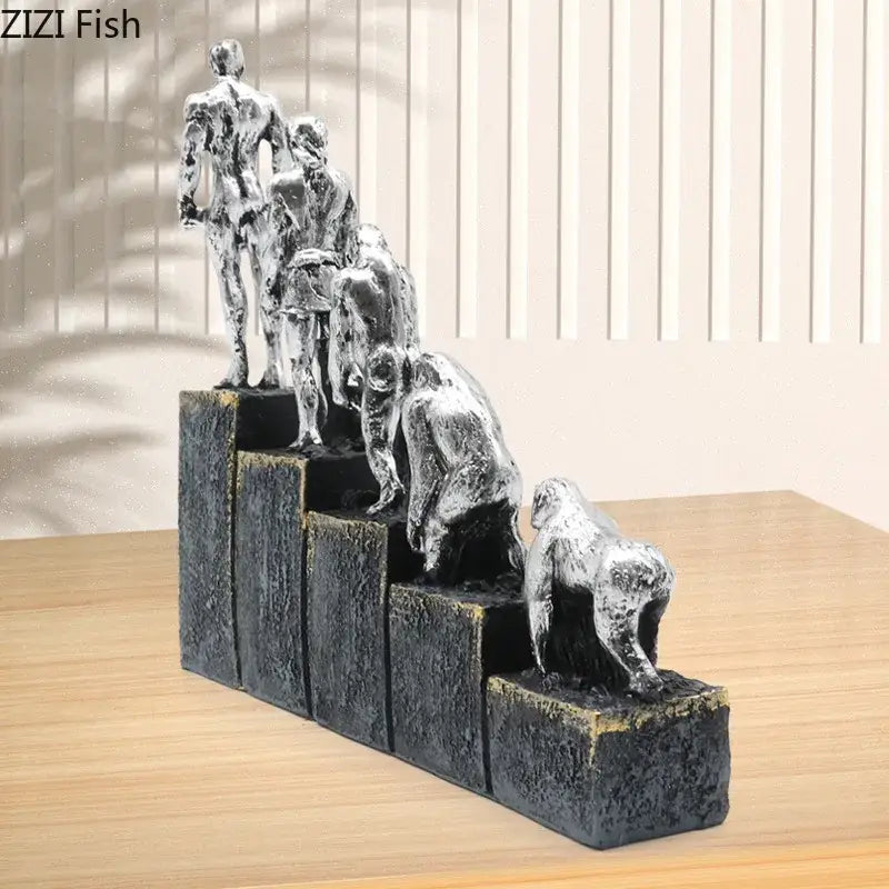 Silver metallic resin decorbites ape man evolution sculpture depicting man evolution on tiered antique finish steps
