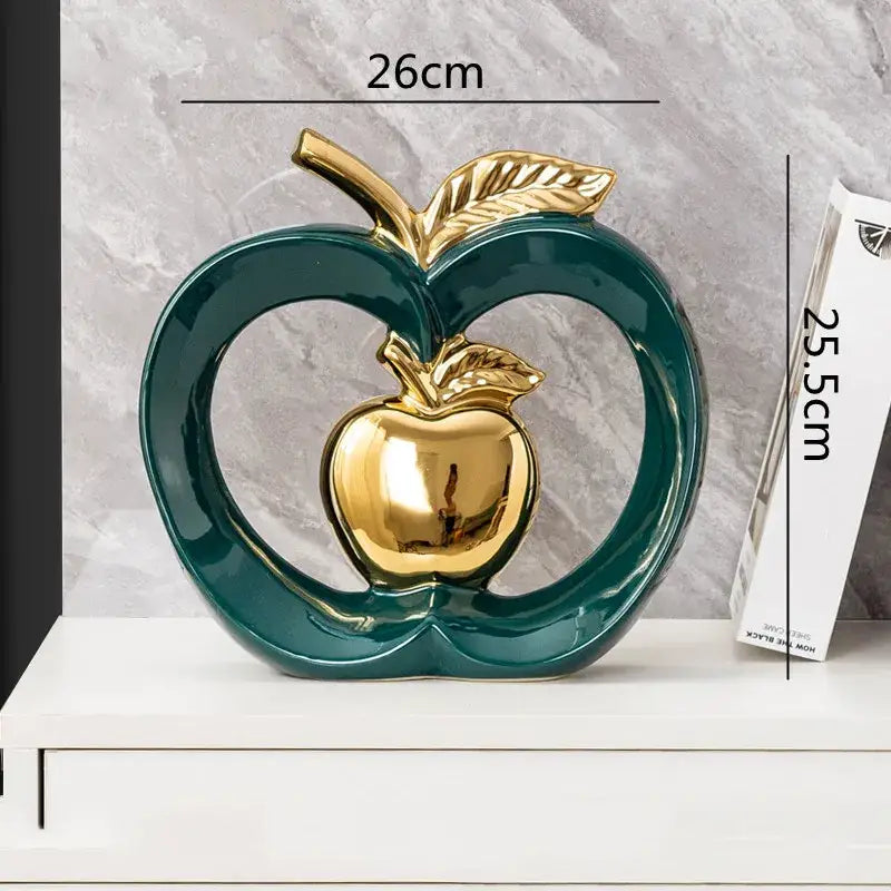 Glossy teal ceramic decorbites apple hollow candy jar with golden metallic center and leaf accents for home decor