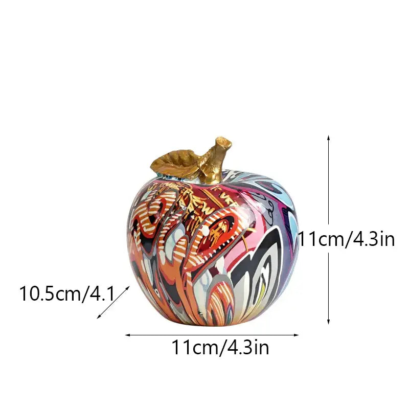 DecorBites apple sculpture resin ornament featuring vibrant graffiti-style paint and a golden stem for modern decor