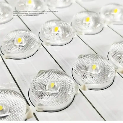 Clear circular led light modules with textured glass lenses and yellowish emitters in decorbites apple shape ceiling chandelier