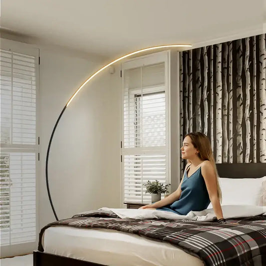 DecorBites arc floor lamp with curved black metal frame and warm LED strip for indoor dining and living room decor