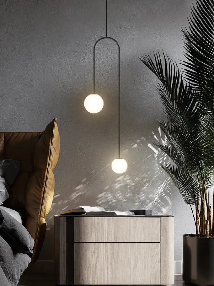 Modern black metal pendant light with two white glass bulbs from decorbites arc line chandelier for living and dining room