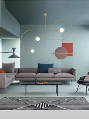 Gold-toned decorbites arc line chandelier with curved metallic arms and spherical bulbs for living dining room kitchens