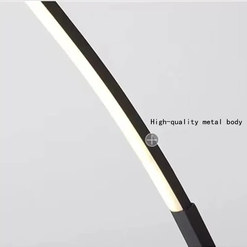A sleek DecorBites arc shape floor lamp with black metal body and illuminated white LED strip for modern decor