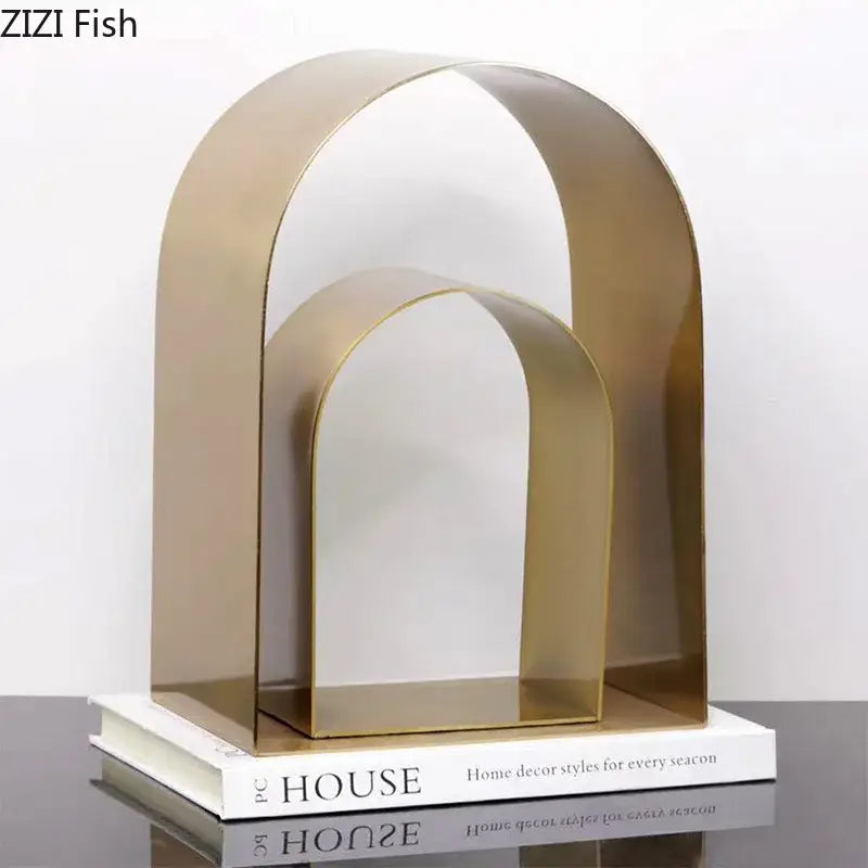 Gold-toned metallic decorbites arches geometry desk sculpture with sleek minimalist design for modern room aesthetics
