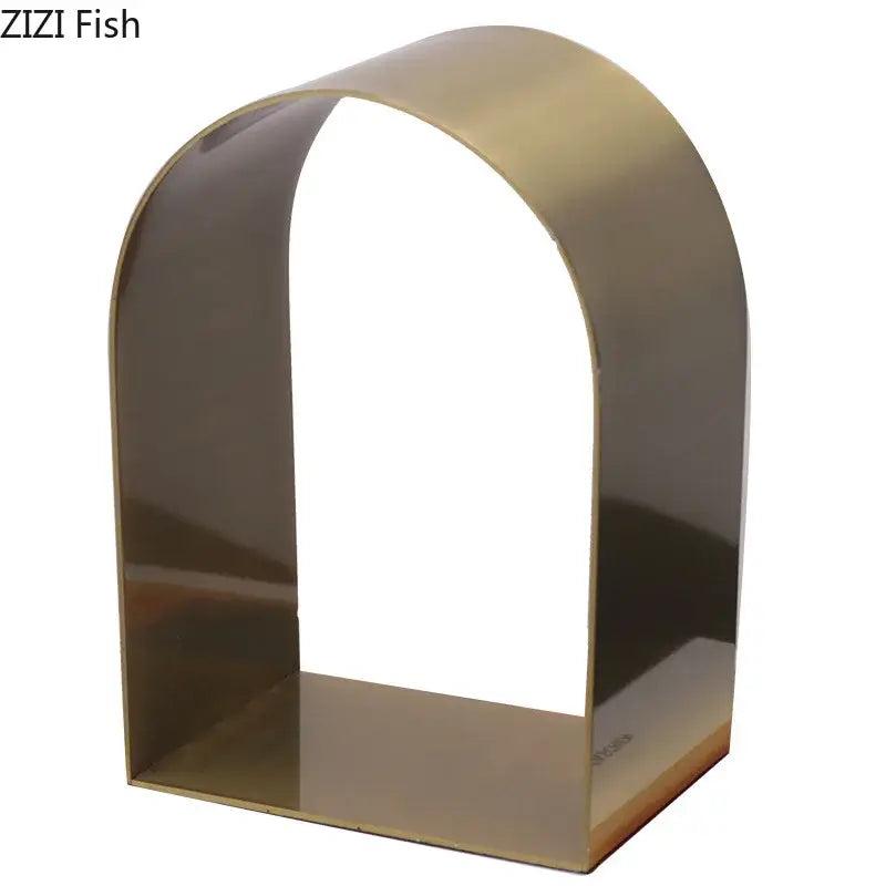 A sleek polished brass decorbites arches geometry bookend with minimalist design for modern geometry desk decoration