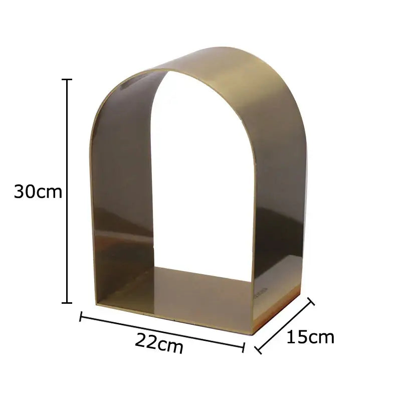 A sleek polished brass metal decorbites arches geometry desk sculpture with clean lines for modern room aesthetics