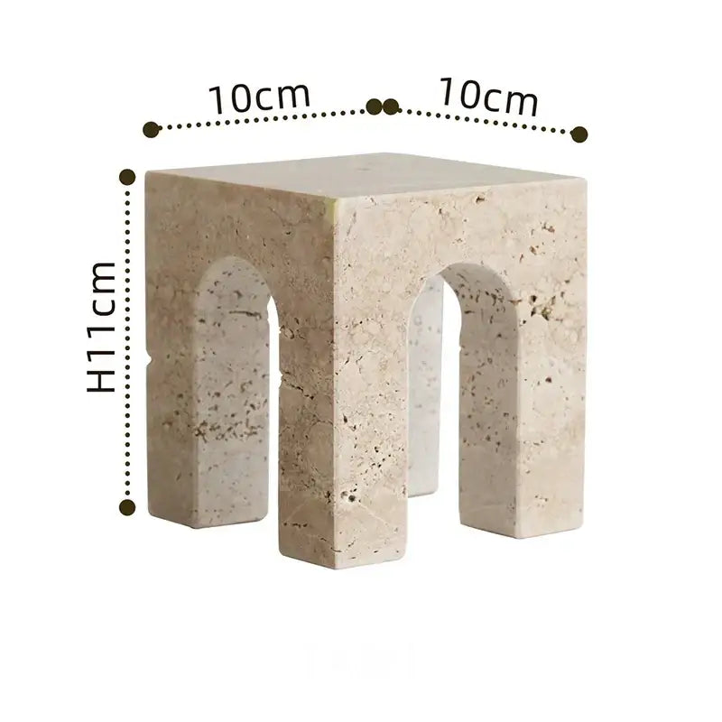 Beige stone side table with archway shape cutouts and textured natural finish by DecorBites archway shape travertine