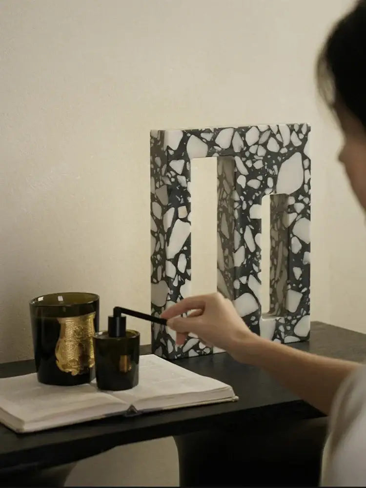 Black glass candle holder with gold embossed design in decorbites archway terrazzo sculpture for home decor