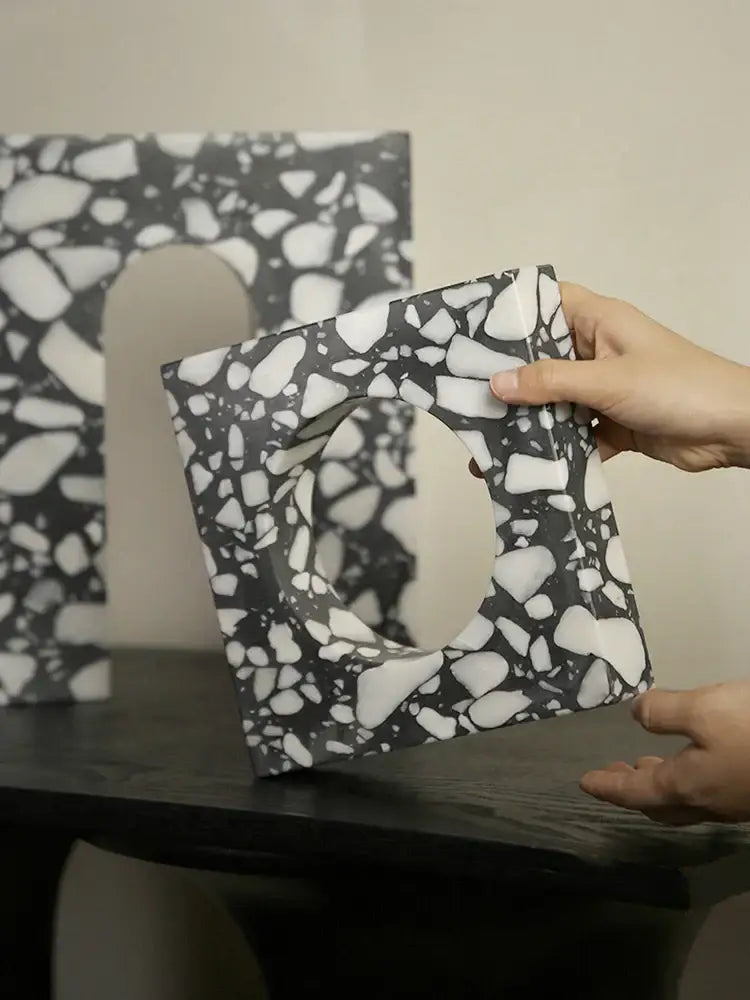 Black and white terrazzo square frame with central oval cutout decorbites archway terrazzo sculpture for home decor