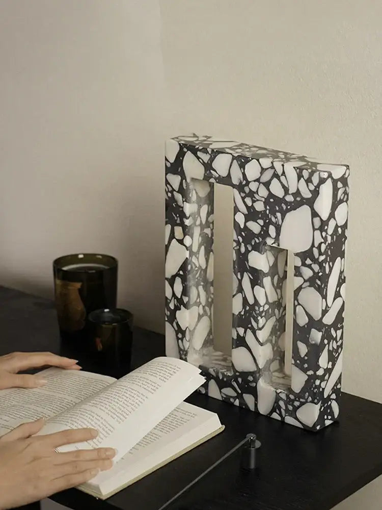 Black and white terrazzo sculpture bookend with modern textured surface decorbites archway terrazzo for home decor