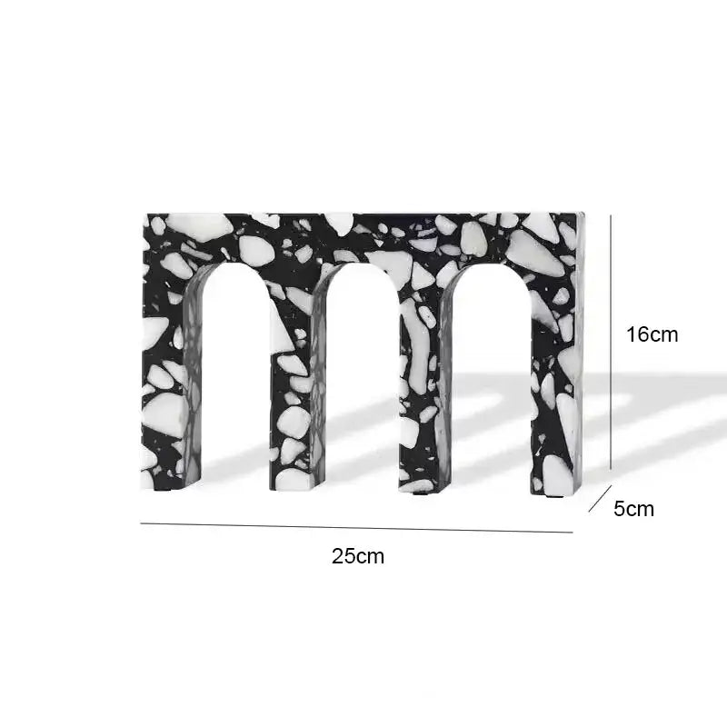 Black and white terrazzo sculpture featuring a decorbites archway terrazzo with three arched openings for home decor