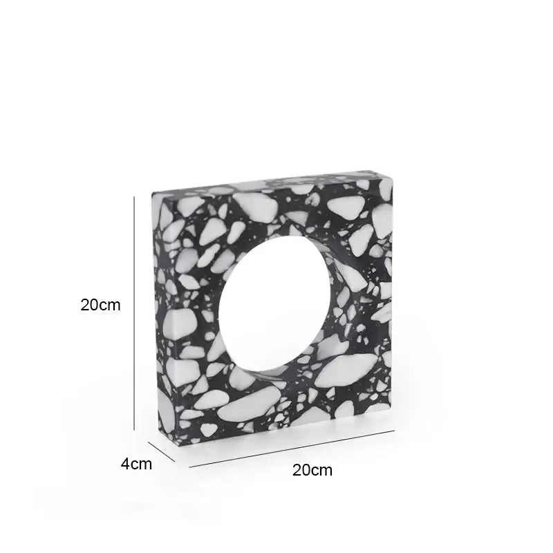 A sleek 20cm square black and white pebble terrazzo sculpture with central circular opening decorbites archway terrazzo