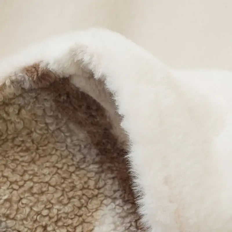 Soft white shearling-lined back of decorbites arctic velvet faux rabbit throw blanket with beige fleece backing