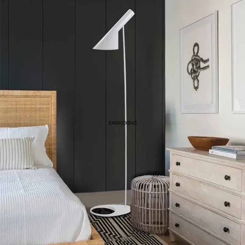 White minimalist floor lamp with sleek angular shade and slender pole from decorbites arne jacobsen corner LED collection