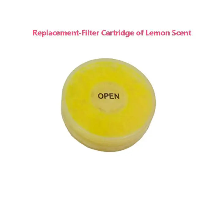 A bright yellow circular replacement filter cartridge with open label for DecorBites aroma shower head filtration