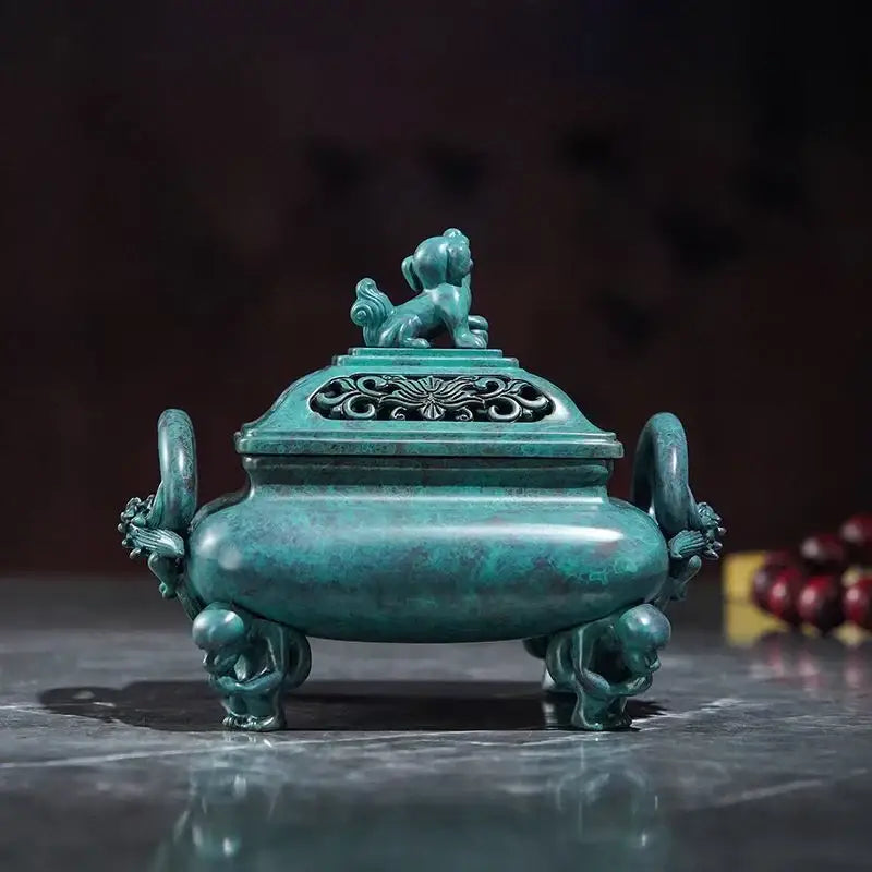 A teal patina bronze decorbites aromatherapy brass incense stove with ornate dragon handles and lion figurine lid for home decor