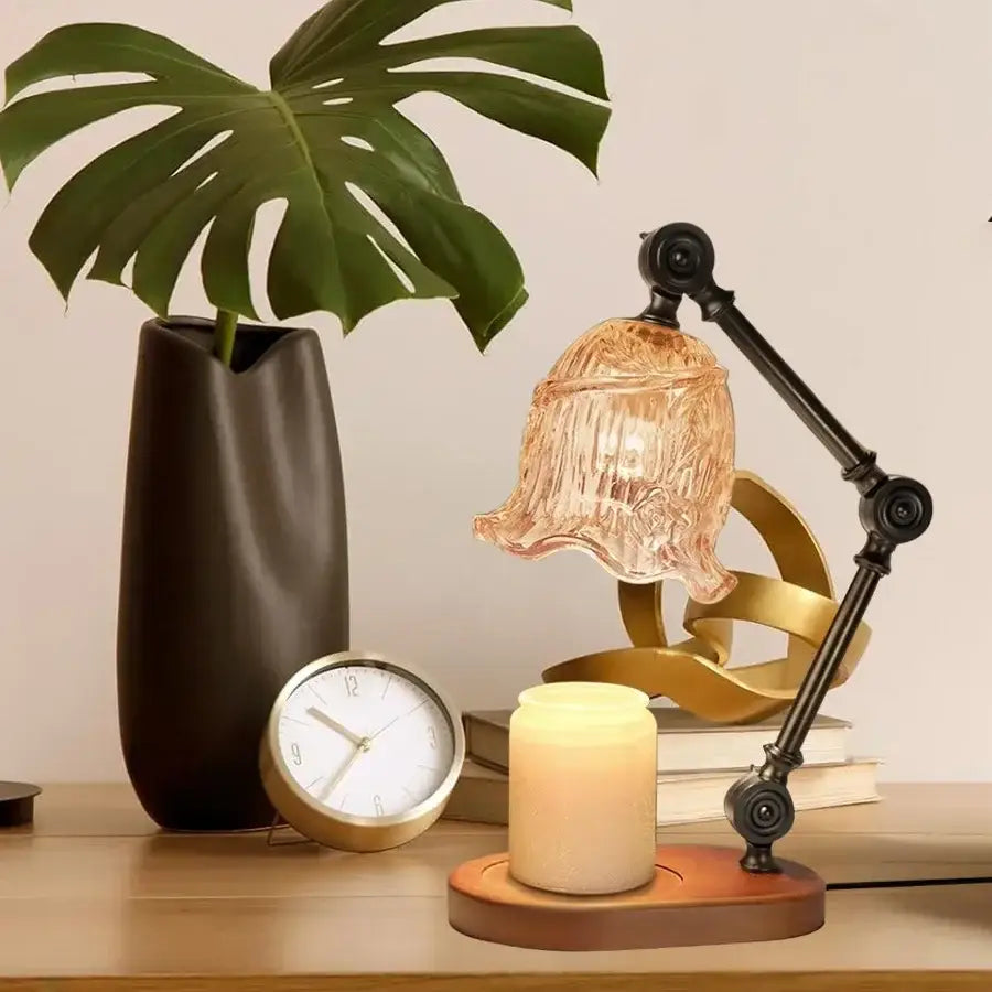 DecorBites™ wax melting lamp with black articulated arm, gold base, and amber glass shade for aromatherapy use