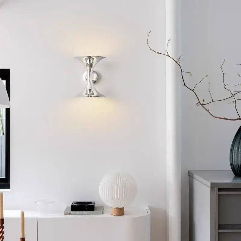 Silver metallic decorbites™ art deco chrome horn wall light with sleek sculptural design and two curved arms for indoor lighting