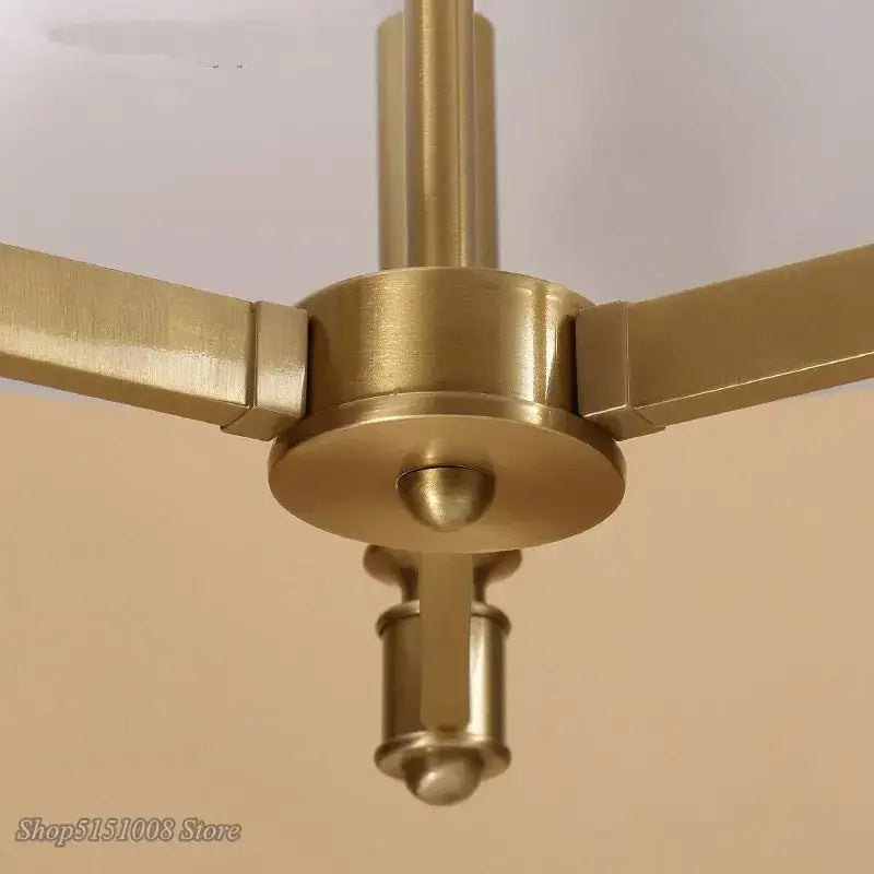 Decorbites art deco pendant light with brass finished geometric arms and central hub for dining and living rooms