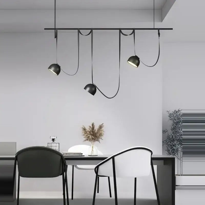 DecorBites™ Art Deco cross belt black orange lustre hanging lamp with matte black dome shades and curved cords