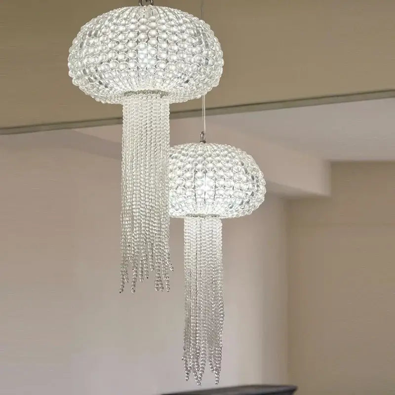 Two elegant clear crystal art deco dimmable chandeliers shaped like jellyfish by DecorBites for dining room lighting