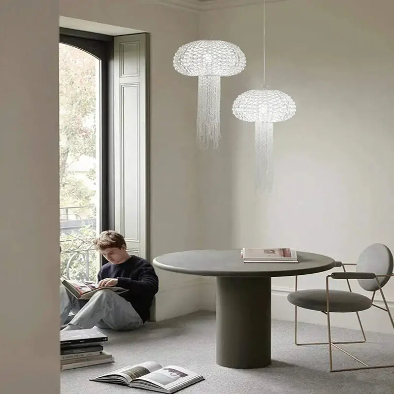 Two elegant translucent white jellyfish-shaped art deco dimmable pendant lights with crystal strands by decorbites hanging
